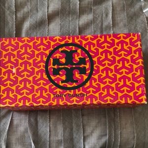 Reva Rocco’s Python Print with Gold Metal Logo